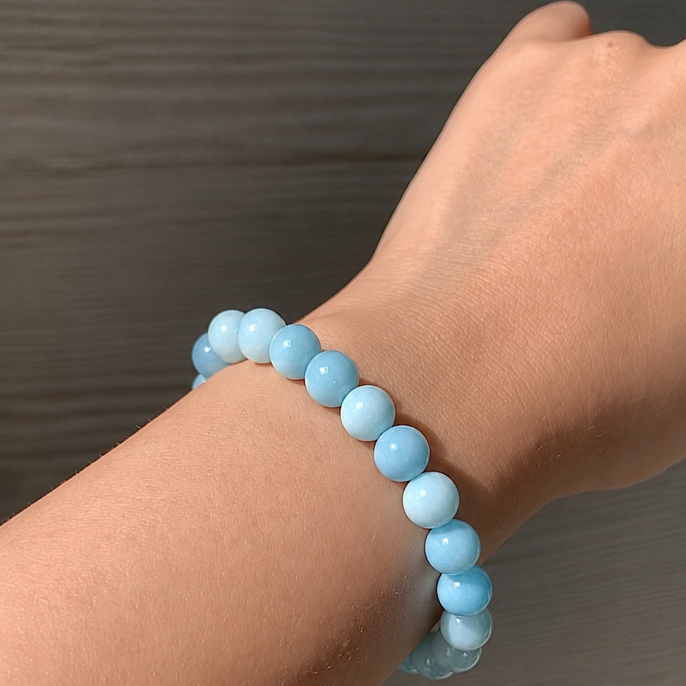 Blue Jade Peace Bracelet worn on the wrist