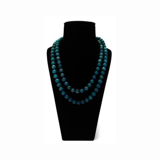 Apatite beaded mala in teal blue round beads, shown doubled on a black velvet bust