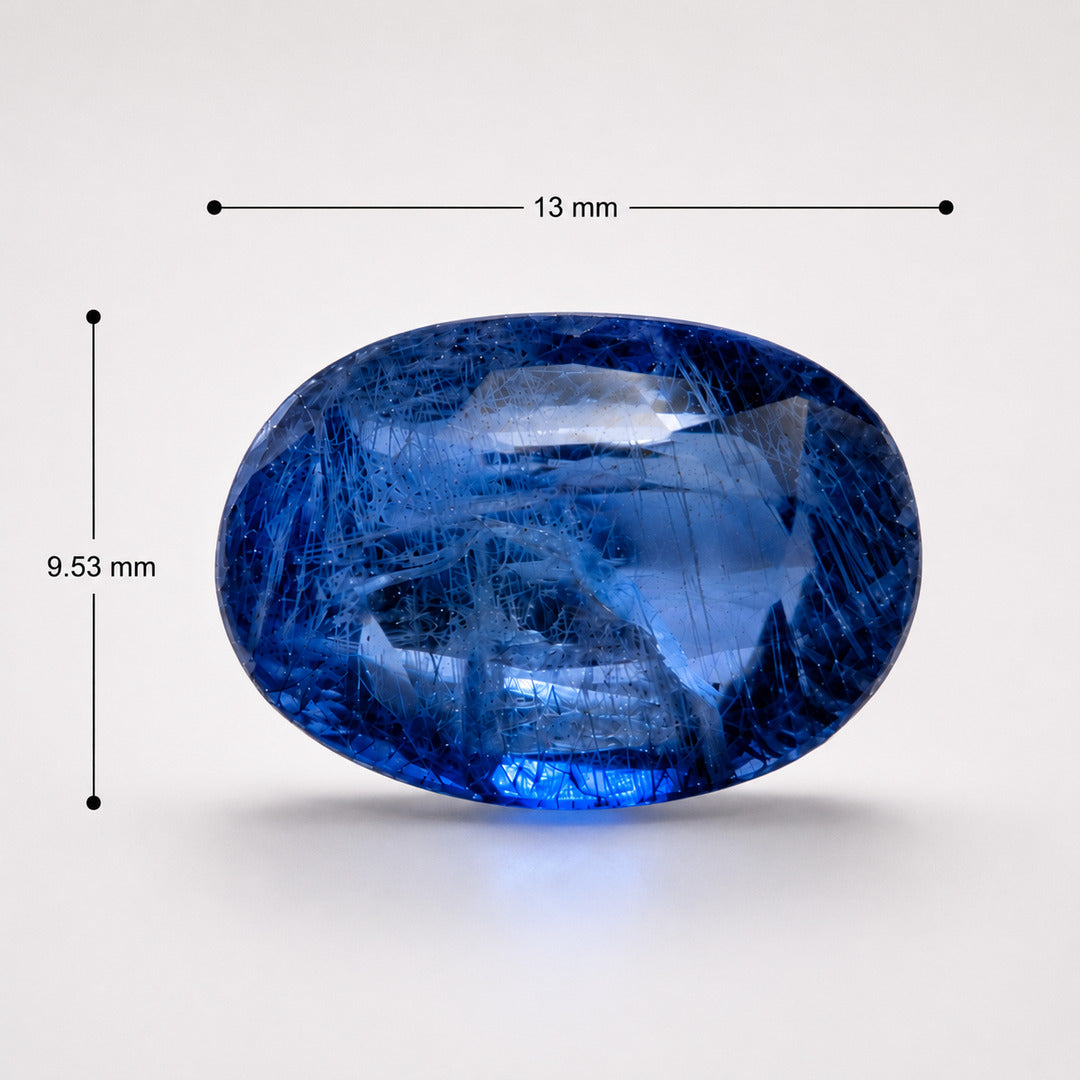 Blue sapphire oval gemstone with measurements marked at 13 mm by 9.53 mm